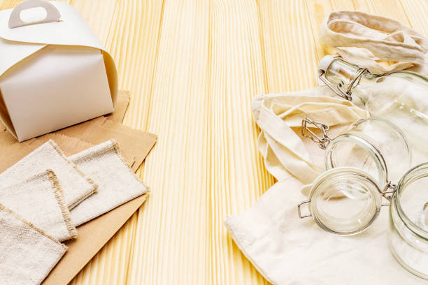 istock Assortment eco friendly packaging, zero waste, paper, glass and textile for free plastic shopping. Recycled materials 1179880354