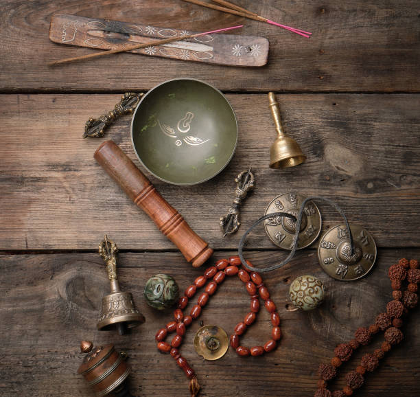 istock Copper singing bowl, prayer beads, prayer drum and other Tibetan religious objects for meditation and alternative medicine 1179884861