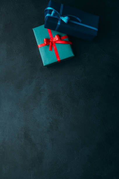 istock holiday surprise gift boxes teal blue background 1179885127