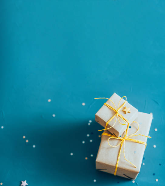 istock holiday surprise beige paper gift boxes teal blue 1179885148