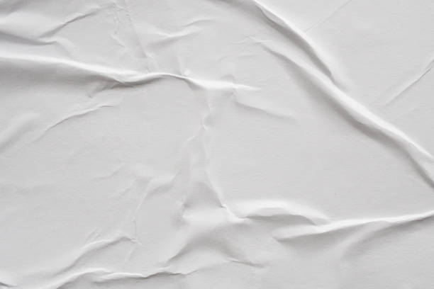 istock Blank white crumpled and creased paper poster texture background 1179885164