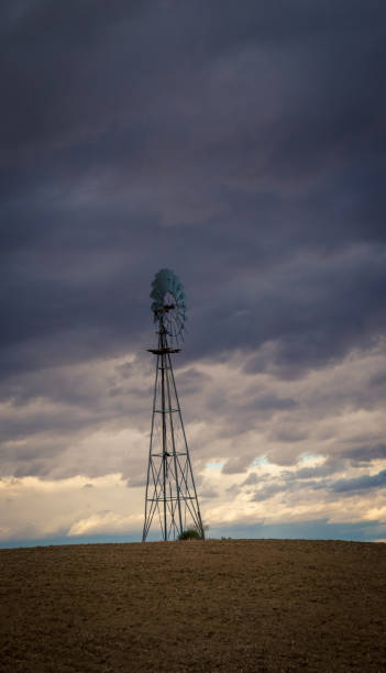 istock Steel windmill with cloudy skies 1179887761