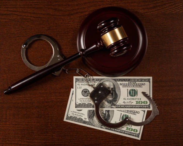 Gavel and money Gavel and money on wooden table bail bond services stock pictures, royalty-free photos & images
