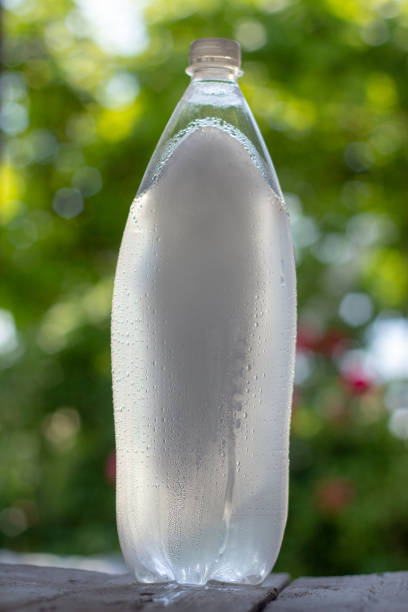 istock Drops of condensate on a plastic bottle with frozen water inside 1179890966