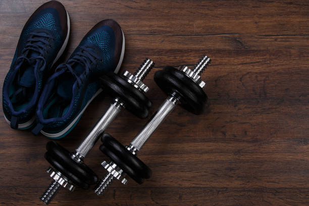 istock DUmbbells and sneakers 1179893568