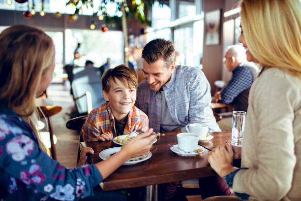 istock Family in a Cafe 1179894330