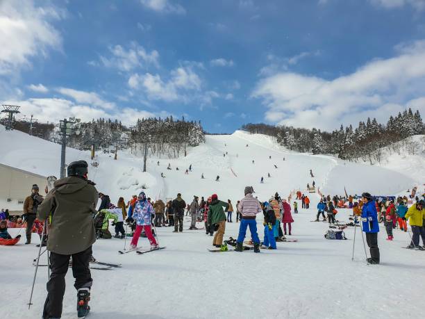 people playing ski at gala yuzawa snow resort Winter - people playing ski at gala yuzawa snow resort , japan 02/02/2018 japanese snowboarder stock pictures, royalty-free photos & images