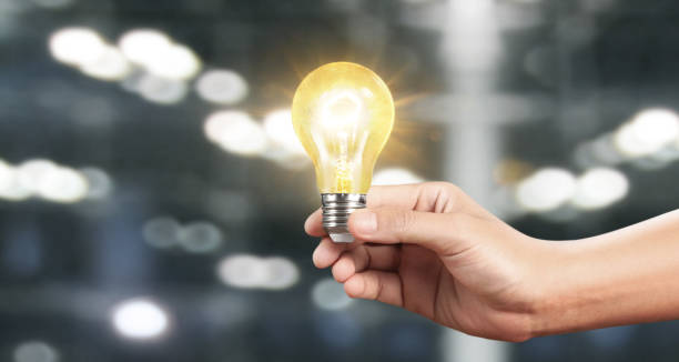istock Hand of holding illuminated light bulb, innovation inspiration concept 1179894568