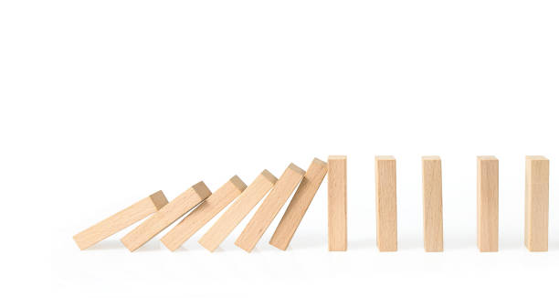 istock Hand stopping the Domino effect stopped by unique 1179894583