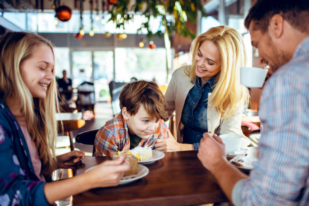 istock Family in a Cafe 1179899806