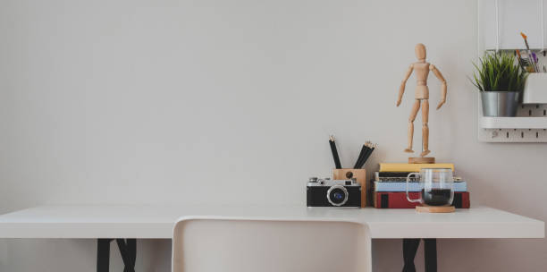 istock Minimal home-office with office supplies and decorations on white wooden table background 1179905372