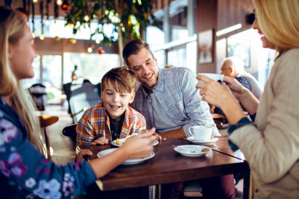 istock Family in a Cafe 1179910537