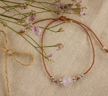 Close up of flower gemstone earrings
