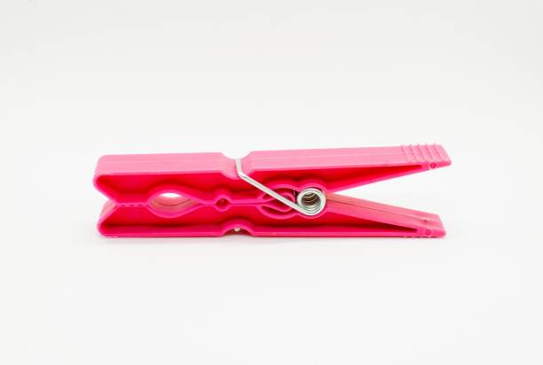 istock A red clothes peg isolated on white background. 1179913852