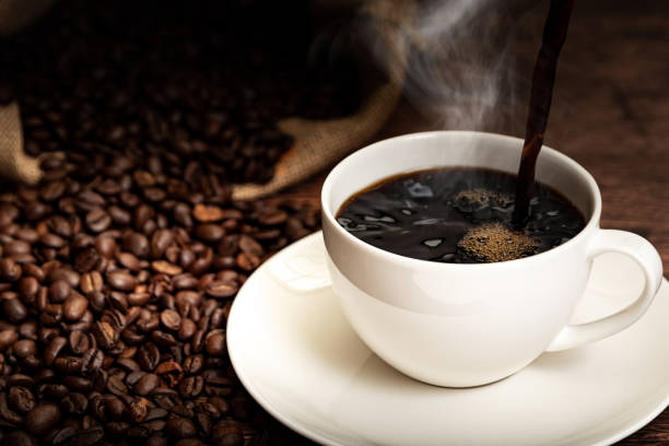 Coffee cup and coffee beans Coffee cup and coffee beans black coffee stock pictures, royalty-free photos & images