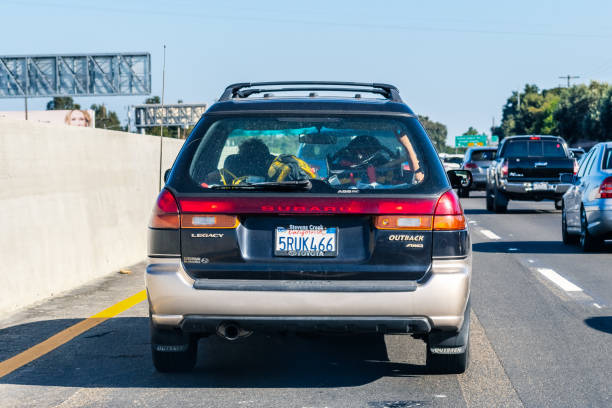 Old Subaru Outback driving on the freeway Sep 26, 2019 Mountain View / CA / USA - Subaru Outback driving on the freeway; Rear view of the first generation of Subaru Outback (1996), a variant of the Legacy with heightened suspension 1996 2019 stock pictures, royalty-free photos & images