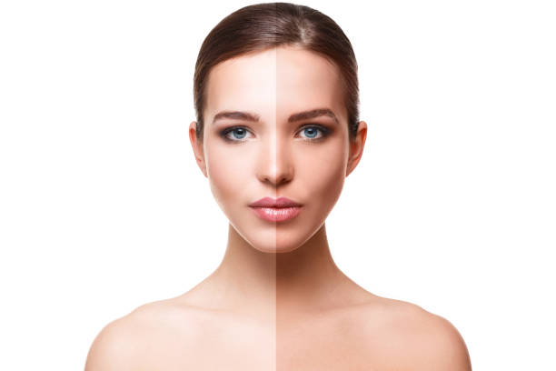 istock Woman face with half tan skin 1179921407