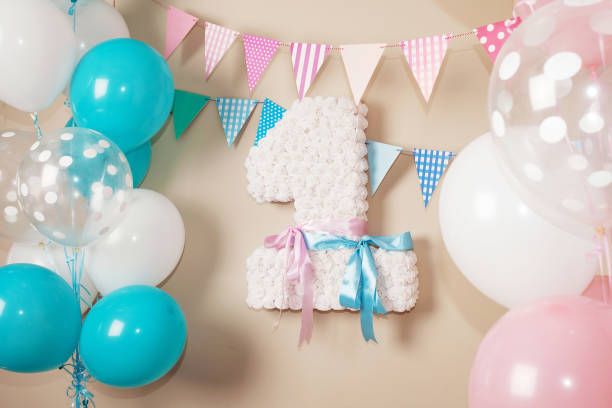 Decorated number 1 for a birthday. Happy birthday one year for twins. White, pink, blue colors stock photo