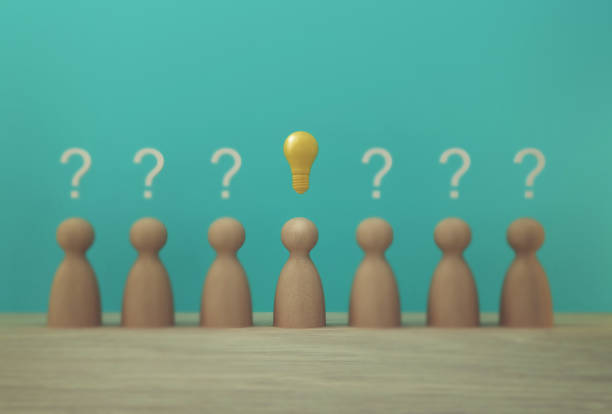istock Outstanding paper people model with light bulb icon and question mark symbol. Concept creative idea and innovation. Human resource and talent management 1179928117