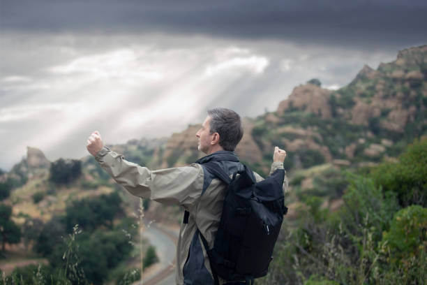 istock Middle Aged Caucasian Man Hiking Alone in the Mountains 1179929883