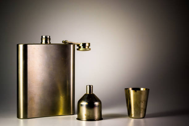 istock Metallic container for liquid, alcohol, whiskey and cognac. Old classic pocket vessel. 1179934283
