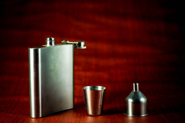 istock Metallic container for liquid, alcohol, whiskey and cognac. Old classic pocket vessel. 1179934295