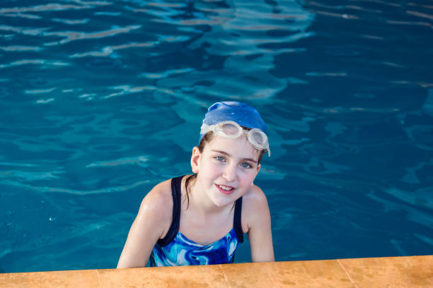 istock Young girl in a swimming pool 1179934412