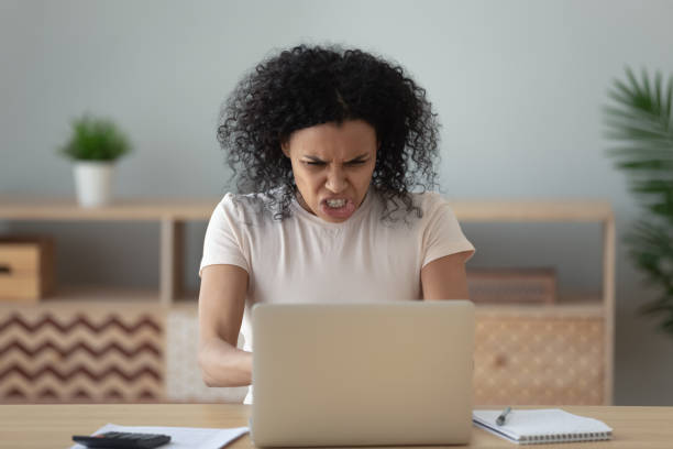 istock Nervous biracial girl get mad having laptop problems 1179938901