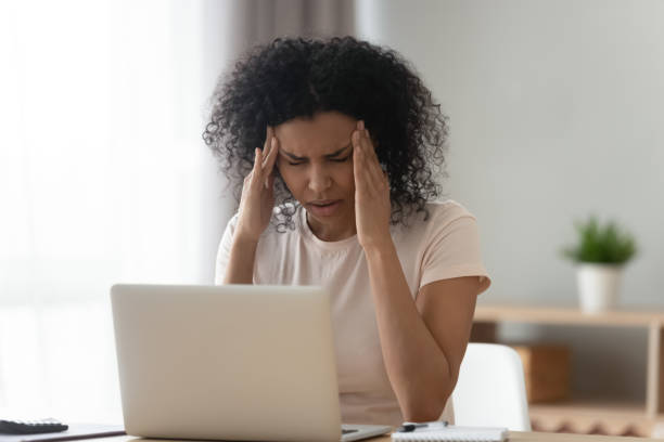 istock Unwell black girl massage head suffering from headache 1179938908