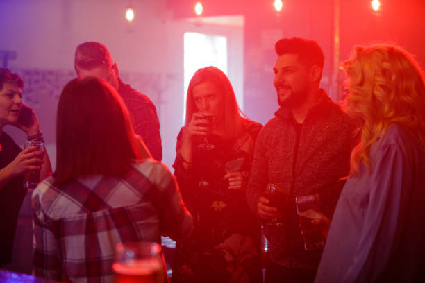istock Happy people gathered in a pub on New Year's eve 1179940849