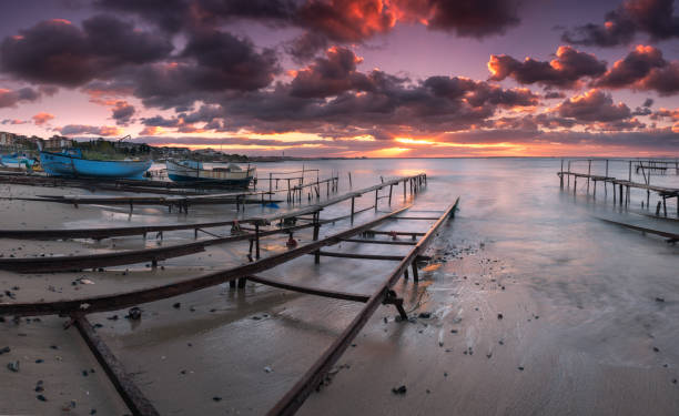 An image of sea sunrise, near the rocks