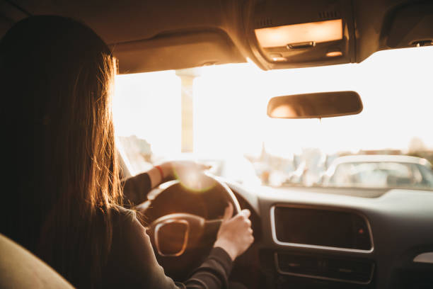 istock Businesswoman driving a car 1179943511