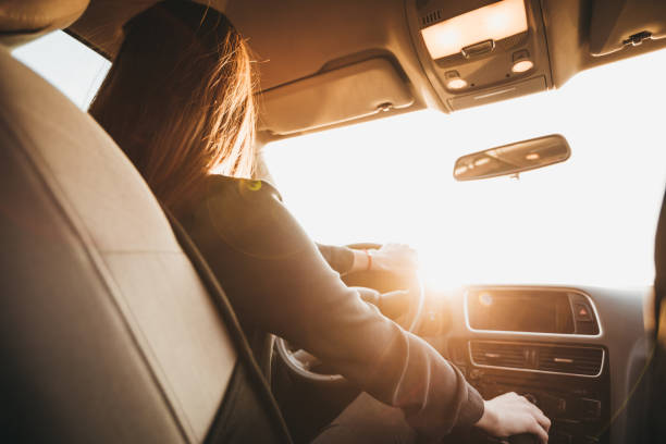 istock Businesswoman driving a car 1179943513