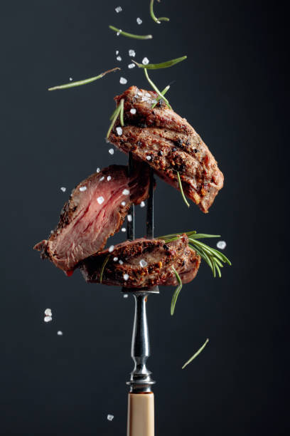 istock Grilled ribeye beef steak with rosemary on a black background. 1179945510