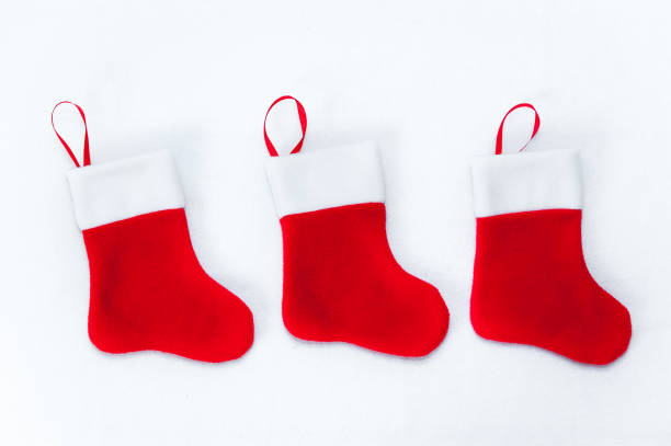 istock New Year sock for presents/new year decoration for a fireplace 1179947561