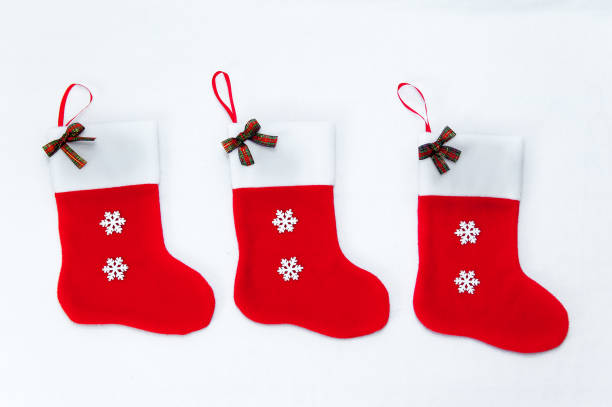 istock New Year sock for presents/new year decoration for a fireplace 1179947589