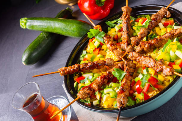 istock Lamb skewers with curry rice and different vegetables 1179948967