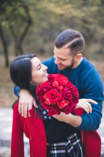 istock young couple in the park 1179950239