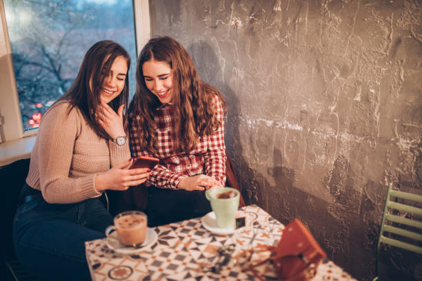 istock Two female friends on a coffee break downtown 1179951511