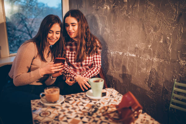 istock Two female friends on a coffee break downtown 1179951620