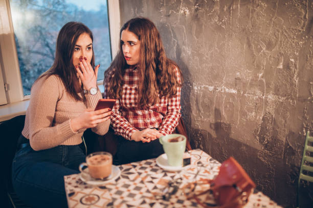 istock Two female friends on a coffee break downtown 1179951774