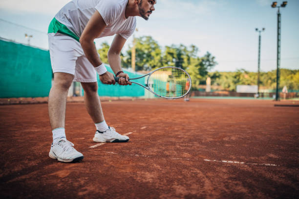 istock Man tennis player waiting for the ball 1179953495