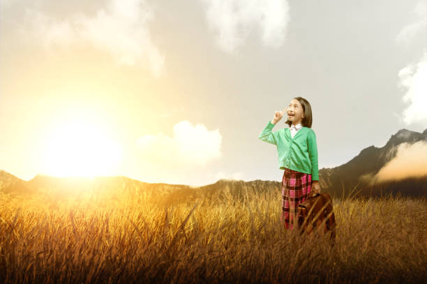 istock Asian cute girl with a suitcase think something 1179954234
