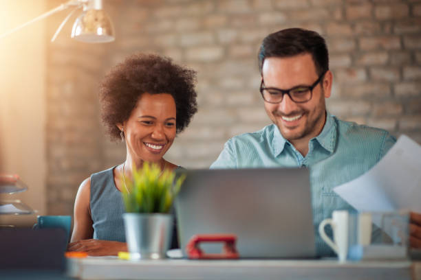 istock Two business people discussing about new project 1179954823
