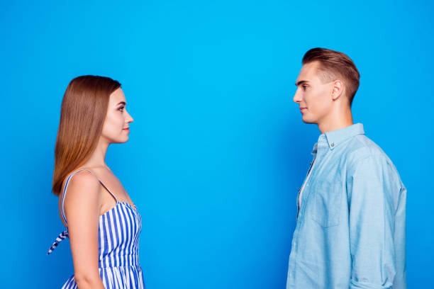 istock Profile side view portrait of her she his he two nice attractive charming lovely content calm people looking at each other trust care isolated over bright vivid shine vibrant blue color background 1179955188