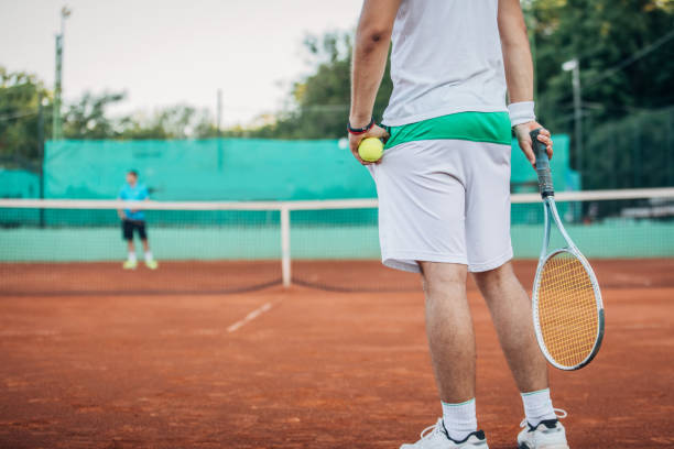 istock Tennis player on clay court 1179955906