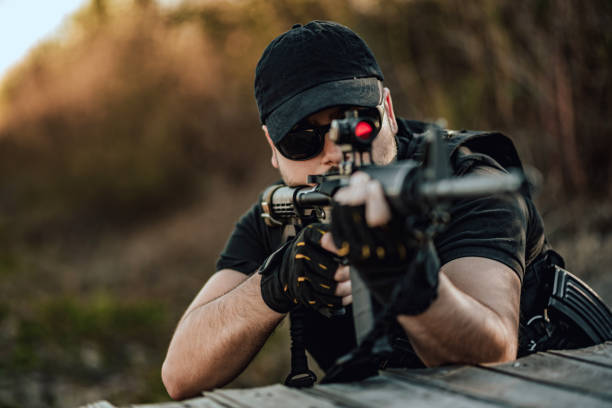 close-up image of man aiming with sniper rifle. - rifle shooting target shooting hunting imagens e fotografias de stock