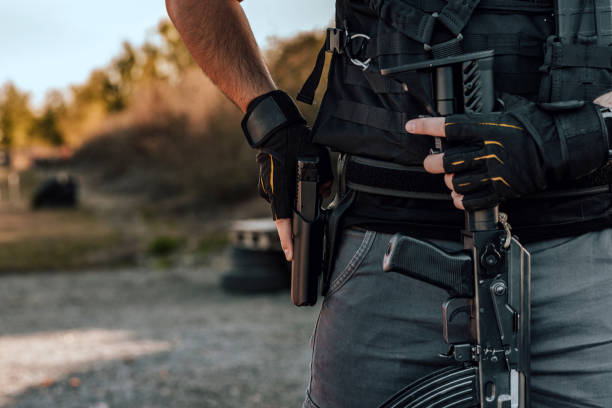 istock Close-up image of a heavily armed man, copy space. 1179956393
