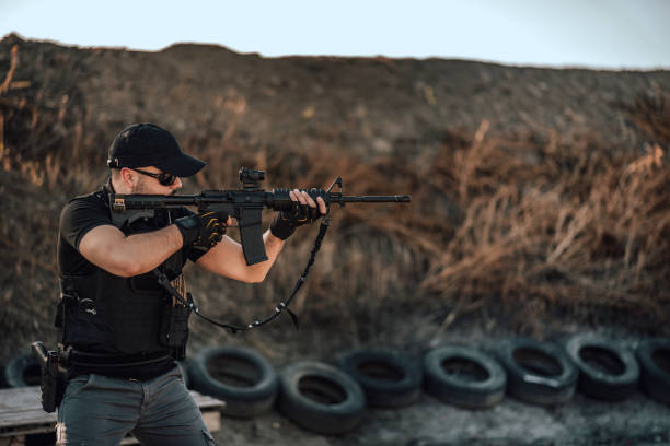 istock Special force member shooting with sniper rifle. 1179956394
