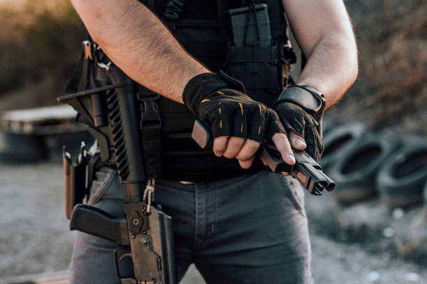 istock Private security man with a gun, the ship ready to shoot. 1179956397